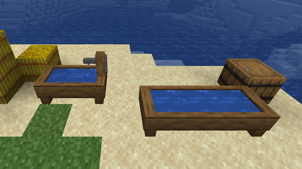 A Timber Well and a Water Trough, both full of water, on a sandy shore