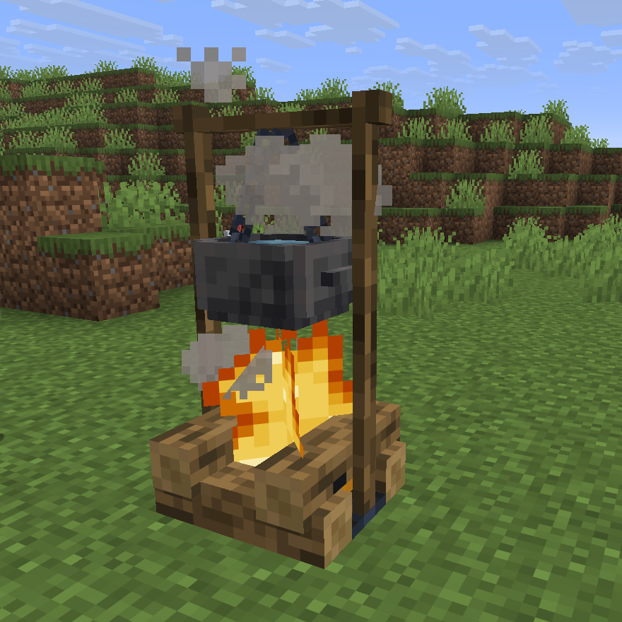 An Iron Hanging Pot of water boiling over a campfire